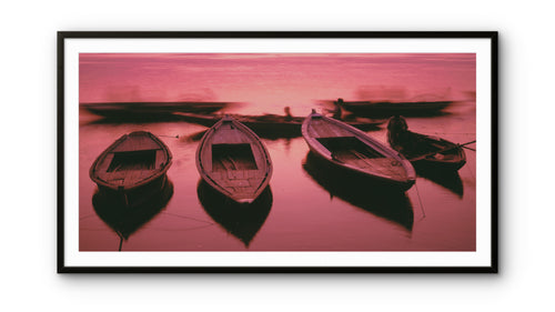 Boats ready for tourists at dawn on the Ganges River.  Banaras, India.