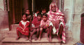 Elderly man and children sitting on their steps.  Banaras, India. (Gallery Print)