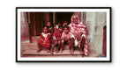Elderly man and children sitting on their steps.  Banaras, India.