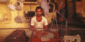 A man in a provisions shop.  Banaras, India.