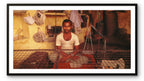 A man in a provisions shop.  Banaras, India.