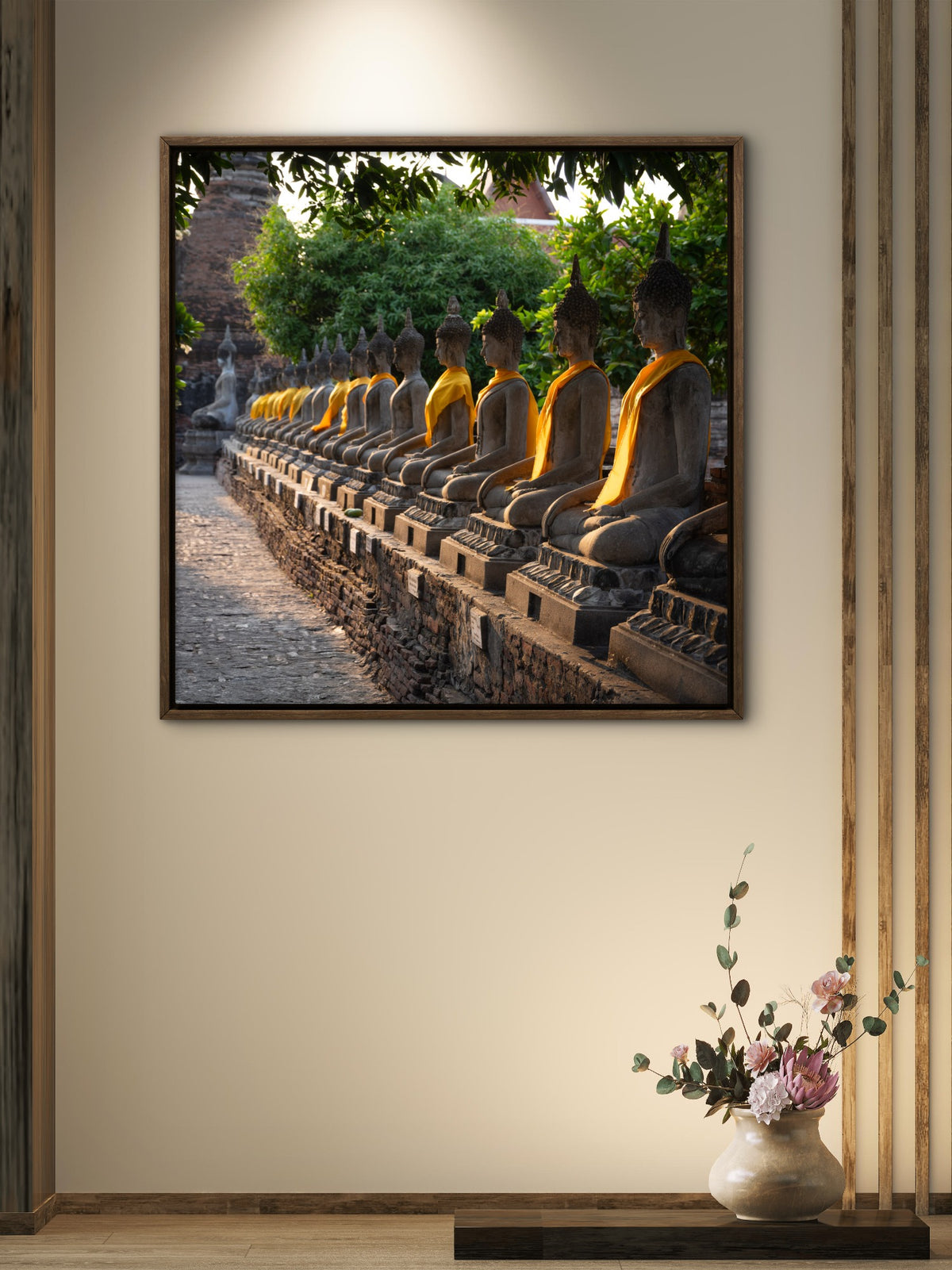 Many buddha statues all in a row in early morning light.  Wat Mahatat, Ayutthaya, Thailand.
