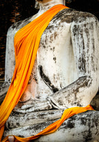 Detail of saffron robes on Buddha.  Ayutthaya, Thailand.